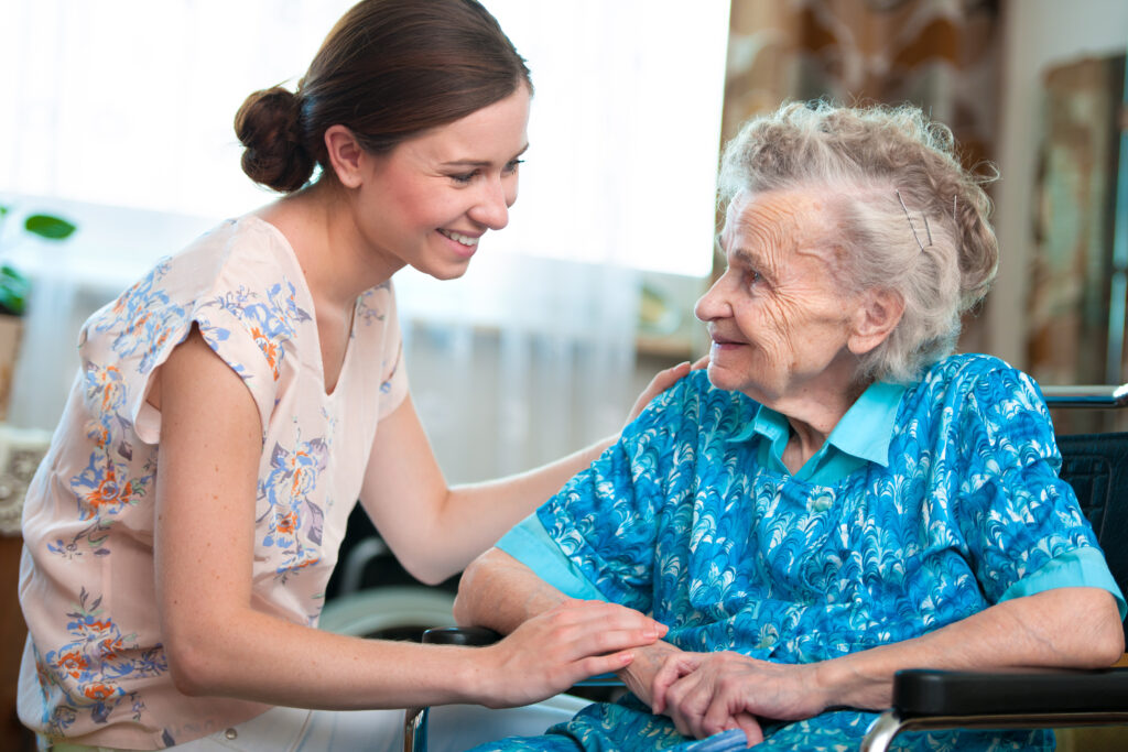 Older woman with her caregiver at home